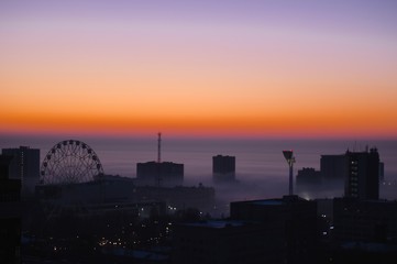 Naklejka premium sunset over the city