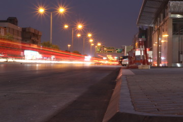 Fototapeta na wymiar Time lapse evening of city roads