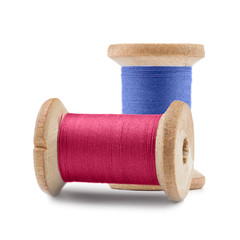 Colorful Spool sewing threads on white background