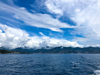Beautiful cloudscape over the Mediterranean sea. Scenic view of Santa Margherita Ligure on the Italian Riviera overlooking the Gulf of Tigullio., Italy, Europe.