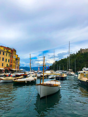 Fototapeta na wymiar Scenic view of yachts and boats moored in the harbor of Portofino on the Italian Riviera. Mediterranean landscape.