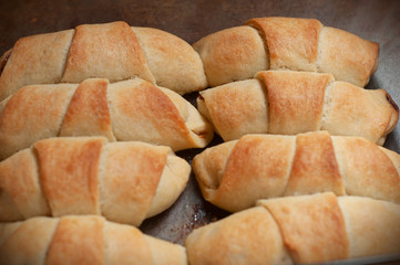 Homemade pastry. The rugelach with jam in a grass container. Homemade holiday cookie.