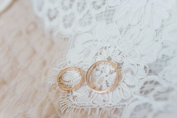 two wedding rings on white background