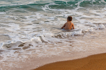 Little boy learn to swim by the sea. Active lifestyle. Weekends, holidays. beach