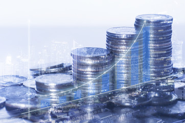double exposure many coins stack with growth graph and chart and city background. business financial banking and money saving concept.