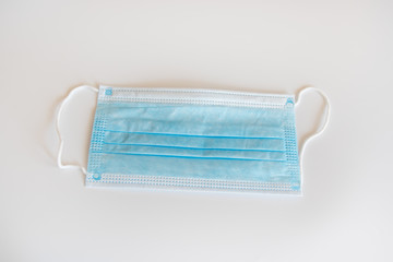 surgical face mask on white background