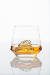 a glass of whiskey with ice