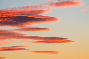 Fototapeta premium abstract shapes of red,orange sunset clouds like painted abstract pattern can be used as background