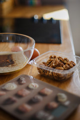 
The ingredients for making muffins lie on a wooden tabletop. photo with place for text
