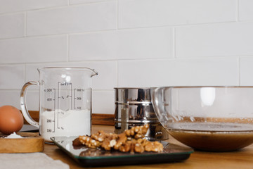 
The ingredients for making muffins lie on a wooden tabletop. photo with place for text