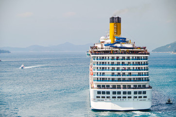 Gigantic huge modern Italian Costa Cruises cruiseship or cruise ship liner departs port of...