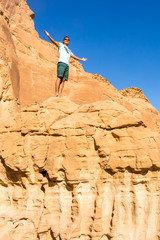 Man with open arms. Holy trip through the historic cities of Israel
