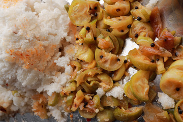 Popular South Indian breakfast puttu / pittu made of steamed rice flour and coconut in the bamboo mould with spicy vegetable curry / utensil, Kerala, India. Bamboo puttu.