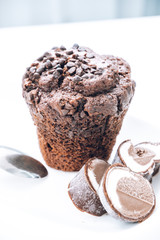 Breakfast in bed with chocolate muffins and ice cream. Chocolate muffin with ice cream and coffee. Chocolate cake with ice cream.