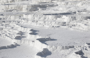 Obraz premium Pamukkale, Turkey - one of the most famous attractions of Turkey, and a Unesco World Heritage site, Pamukkale is visited by millions each year. Here in particular the white travertine terraces