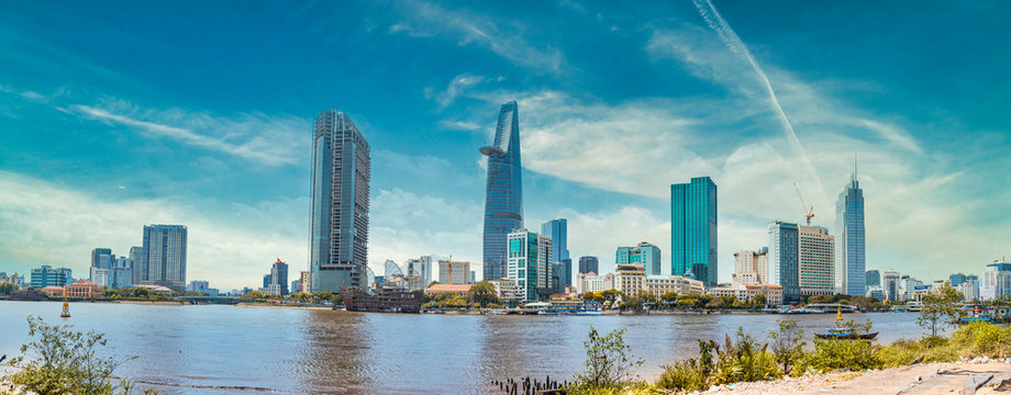 Saigon skyline and the Saigon River with Bitexco tower. Ho Chi Minh City is a popular tourist destination of Vietnam.