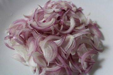 Sliced onion on white background color.