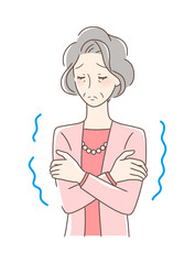 寒気を感じて震える女性