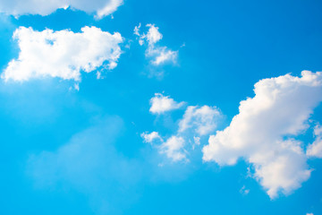blue sky background with tiny clouds.