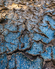 Textures of rusted metal for backgrounds and wallpaper. Blue dried mudscapes and the colorful rusted metal. Oranges, Blues, Greens, Vintage feel, decay.