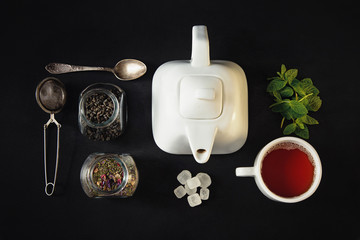 Tea composition flat lay, Teapot with dry tea leaves, Making tea.