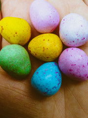 colorful painted easter eggs yellow blue pink speckled