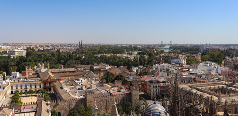 Aerial view of Seville skyline, river, bridge and historical buildings