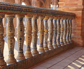 Details of colored little columns in Spain square in a sunny day 