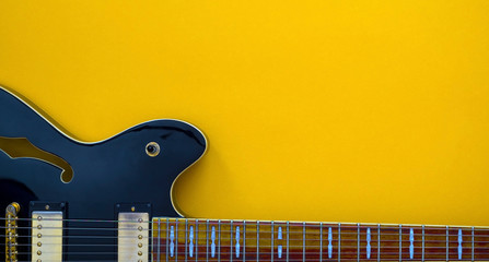 Electric guitar on a yellow background