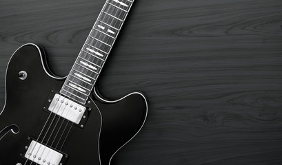 Electric guitar on a dark wood background