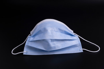 Medical mask for protect COVID-19 on blac k background