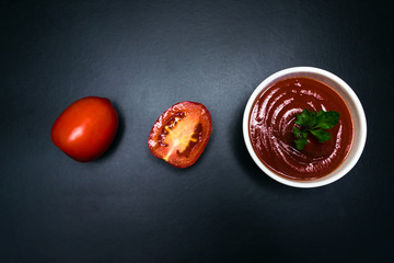 Tomatoes and tomato sauce in a white plate