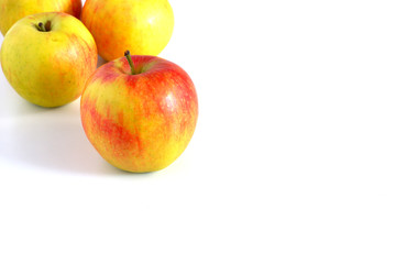 Red apples on a white background. Beautiful delicious healthy fruits.