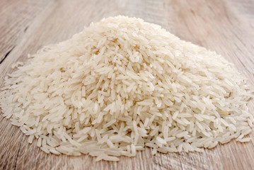 a bunch of long grain rice. Indian rice groats. Close-up.