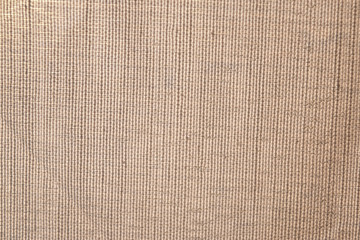 close up on the fabric weft of a beige teztile