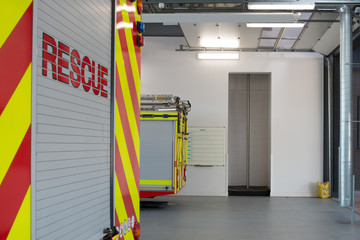 Fire engines in garage and firefighters pole, Basingstoke Fire Station