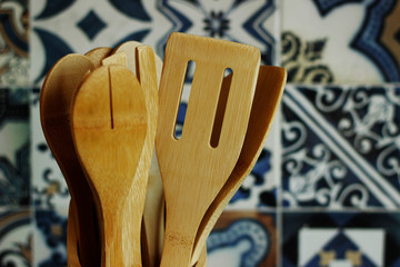 wooden kitchen utensils on wooden background