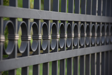 Close up of black metal fence
