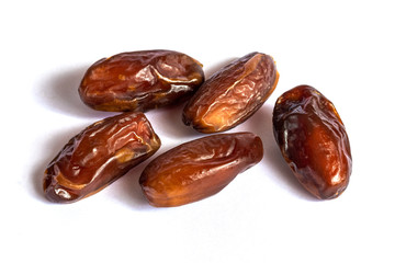 Dry dates on a white isolated background