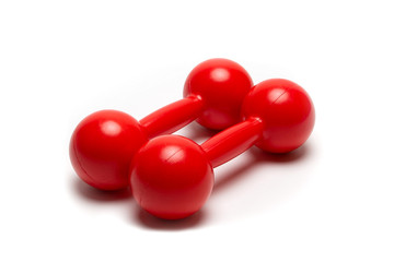 bright red sports dumbbells isolated on a white background