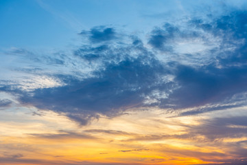 Cumulus clouds on blue sky at sunset