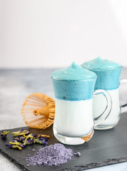 Dalgona Matcha Blue Latte, a creamy whipped matcha in glass