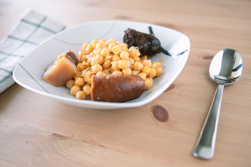 Cocido Madrileño, Typical spanish healthy food, with stewed chickpeas and chorizo