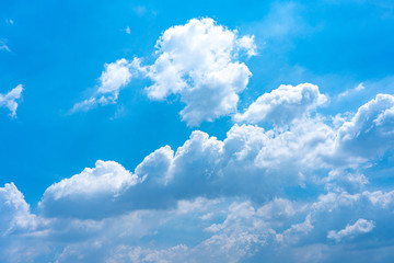 Naklejka na ściany i meble Layers of clouds like huge cotton floating on blue sky