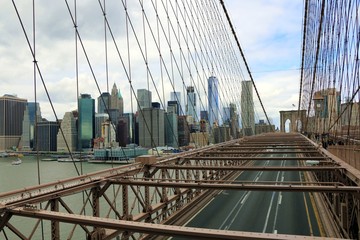 Manhattan, New York, United States. The Brooklyn bridge structure with the skyline of Manhattan in background.