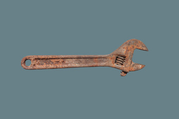 Old, rusty metal wrench for repair.