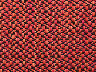 orange, red and black 
woven fabric with an abstract pattern and visible texture. background or...