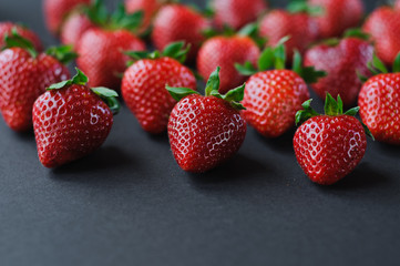 Top view on strawberry frame on blue background. Summer nature background. Berries pattern. Flat lay