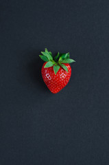 Vegetables and fruits in one color, Top view of arranged fresh strawberries isolated on black