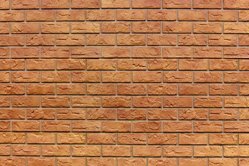 Brick texture. Orange background. Brown wallpaper for designer. Rectangular photo, image.